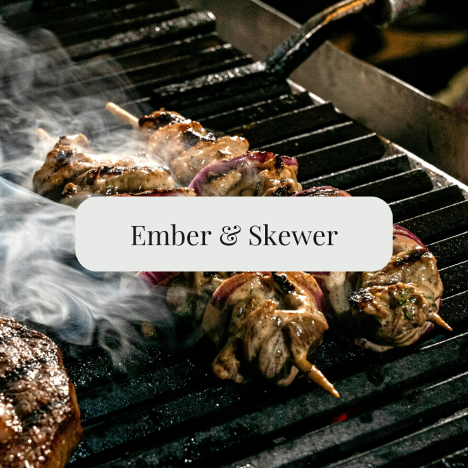 kebab skewers over a smokey bbq